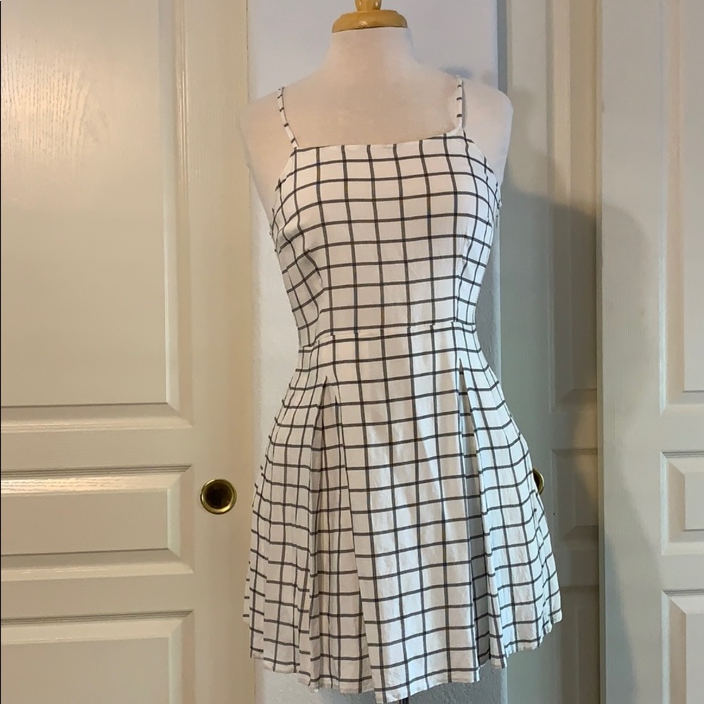 White and black pleated skater dress